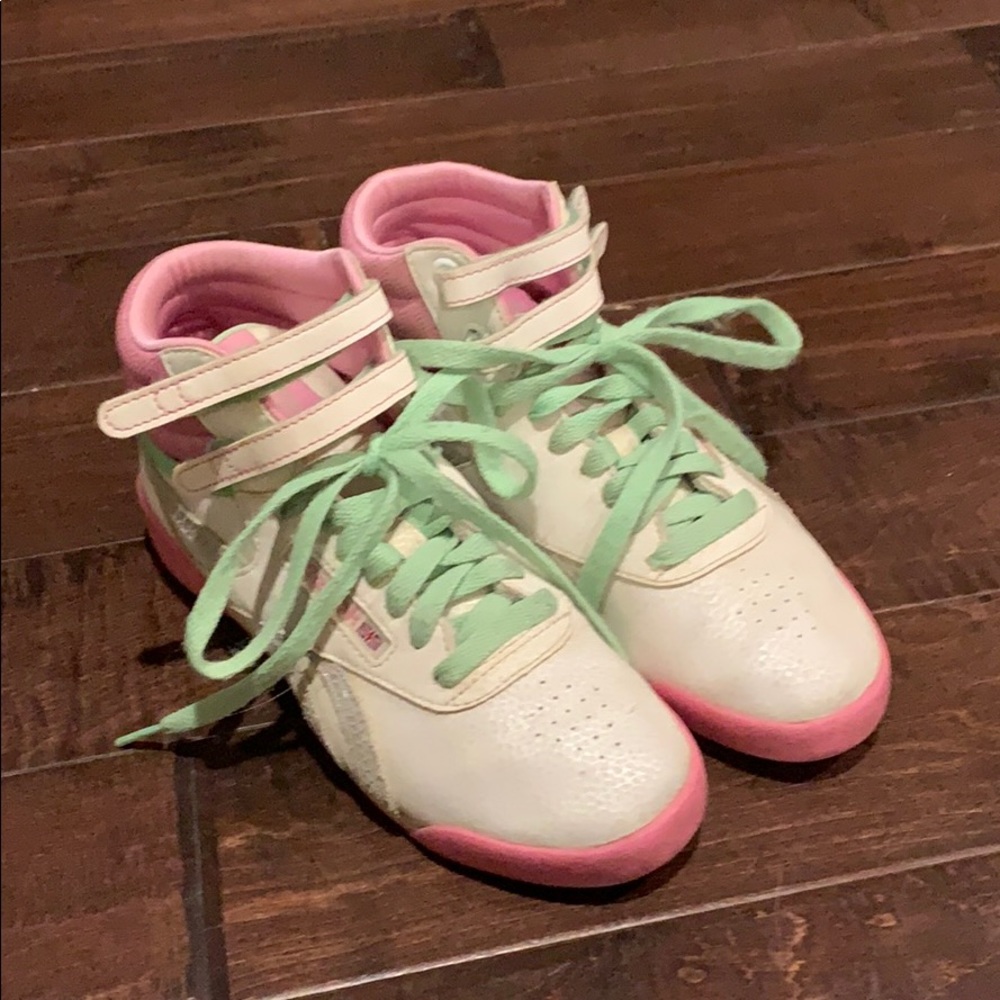 Pink and white pair of Reebok classics